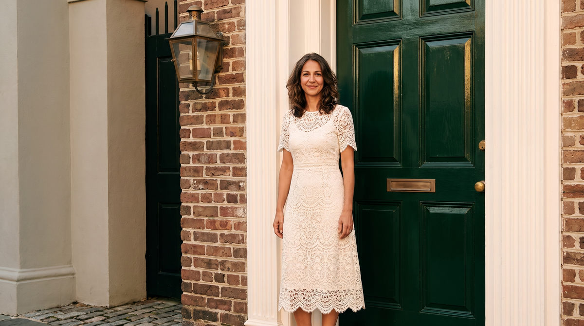 A woman wearing an ivory lace midi dress with a scalloped hem — Lace Dresses